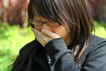 Image showing Asian woman sneezing