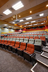 Image showing Lecture hall with colorful chairs in university