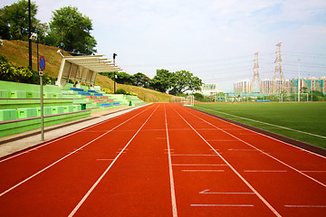 Image showing Stadium chairs and running track