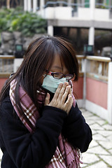 Image showing Asian sick girl wearing mask