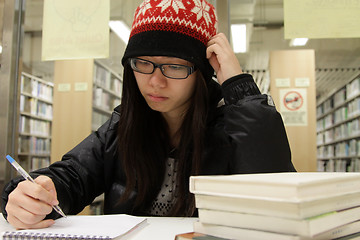 Image showing Asian woman studying in library