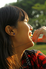 Image showing Asian woman smiling under sunshine