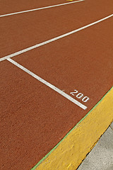 Image showing Running track in a stadium with number 200