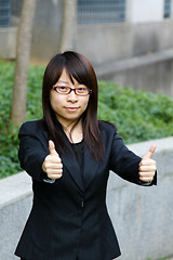 Image showing Asian businesswoman with thumbs up
