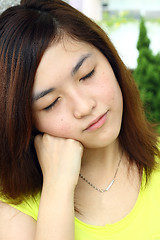 Image showing Asian woman with sleepy face