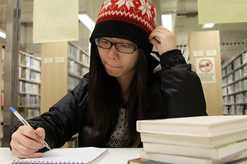 Image showing Asian woman studying in library