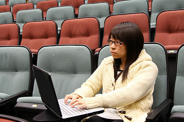 Image showing Asian university student using laptop and studying