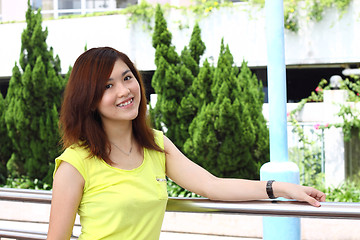Image showing Asian woman smiling outdoor
