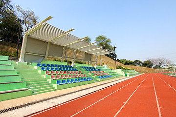 Image showing Stadium seats and running track