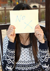 Image showing Woman holding NO signage