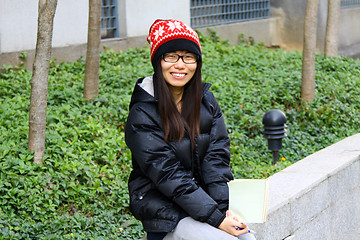 Image showing Asian student smiling on campus