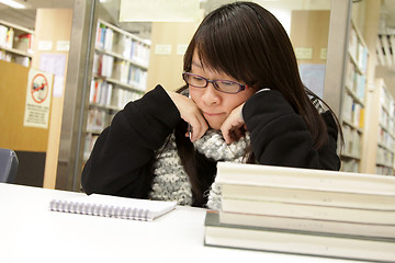 Image showing Asian woman studying in library