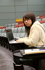 Image showing Asian student using laptop to study