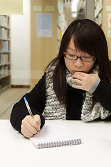 Image showing Asian woman studying in library