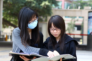 Image showing Asian students studying and discussing in university