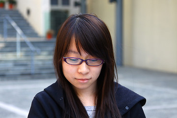 Image showing Asian sad girl thinking