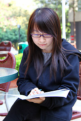 Image showing Asian girl studying in university