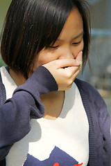 Image showing Asian woman sneezing