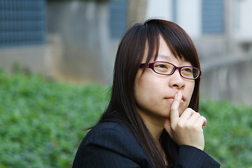 Image showing Asian businesswoman thinking