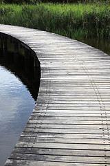 Image showing A wooden path in wetland park