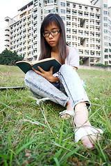 Image showing Asian girl reading in university