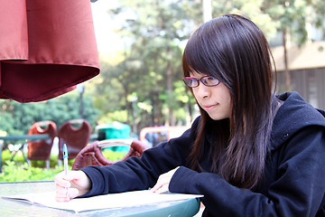 Image showing Asian girl studying in university