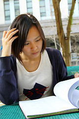 Image showing Asian girl studying in university