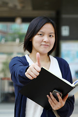 Image showing Asian woman thumbs up