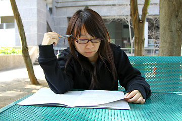 Image showing Asian girl studying in university