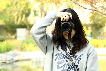 Image showing Asian woman photographer