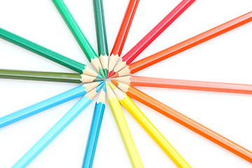 Image showing Color pencils in arrange in color wheel colors on white backgrou