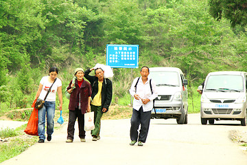 Image showing Farmers go back home in China