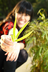 Image showing Asian woman smiling under sunshine