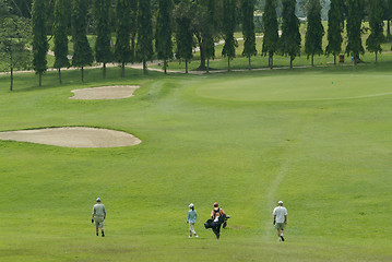 Image showing Golf players walking towards the green