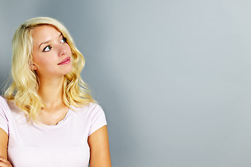 Image showing Young woman looking up