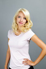 Image showing Young blonde woman standing