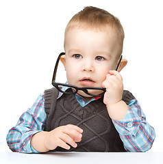 Image showing Portrait of a cute little boy wearing glasses