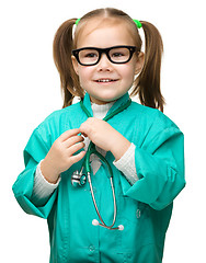 Image showing Cute little girl is playing doctor