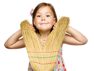 Image showing Portrait of a little girl with broom