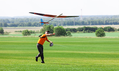 Image showing Man launches into the sky RC glider