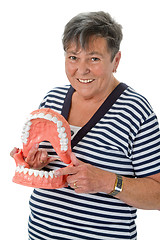 Image showing Senior woman pointing on tooth