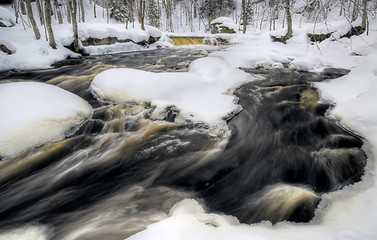 Image showing flowing winter waterfall