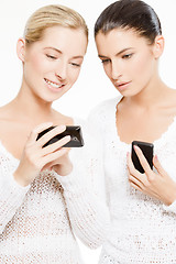 Image showing two young women with smartphones