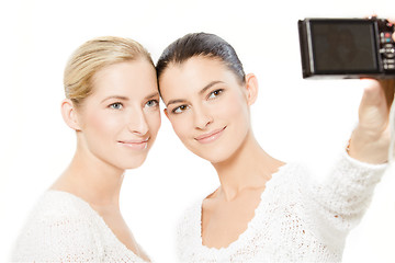 Image showing two young women taking pictures