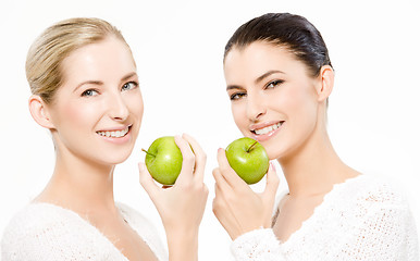 Image showing two smiling women with apples