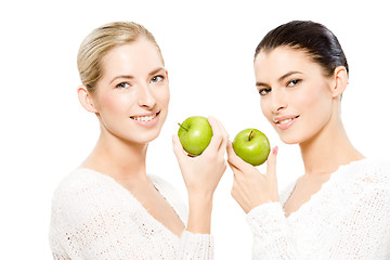 Image showing two smiling women with apples