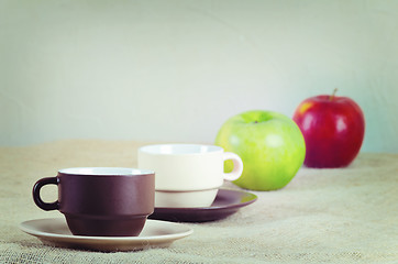 Image showing Cups and apples