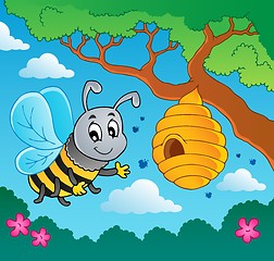 Image showing Cartoon bee with hive