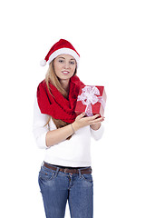 Image showing young smiling girl with red hat and present christmas