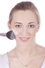 Image showing young beautiful woman applying mineral powder 